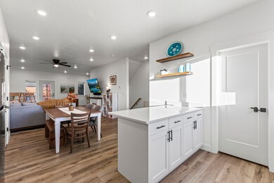 Kitchen featuring TONS of natural light, quartz countertops, and recessed lighting.
