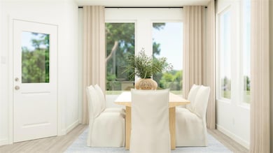 Dining room featuring light wood-style flooring an
