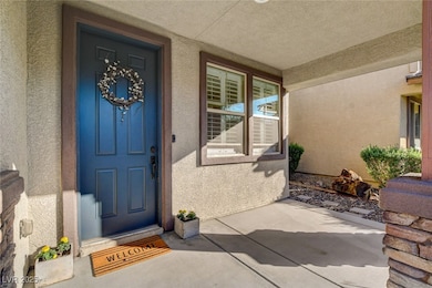 Doorway to property featuring stucco siding and a