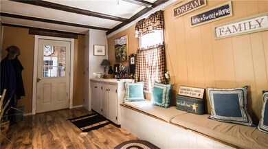 Entrance into home with sitting area.