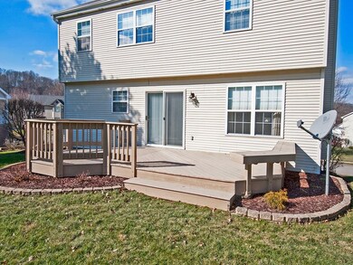 Back deck overlooks large yard which is perfect fo