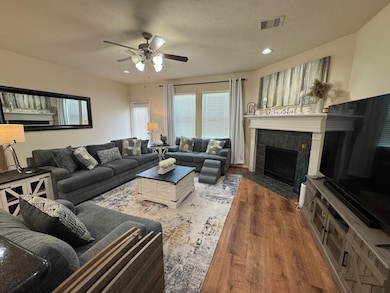 Spacious living area with gas fireplace.