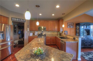The large open kitchen features stainless steel ap