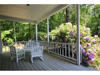 Porch. Another view of the front porch, with recessed ceiling lighting, surrounded by mature landscaping.
