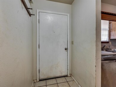 Doorway to property with a sink