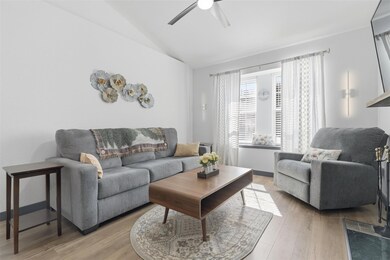 Living room with light wood-style flooring, lofte