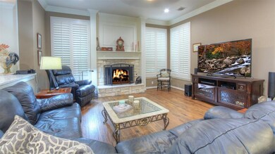 Family room at the back of the house open to the Kitchen. Decorative stone facade gas fireplace. Shutters on windows that offer views to your private oversized backyard. Handscraped hardwood floors throughout the first floor.