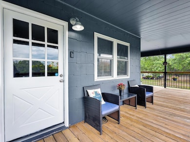 Inviting covered front porch with space for seatin