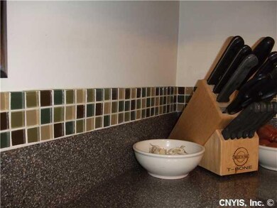 Kitchen. Corian countertops graced by beautiful ne