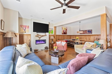 Living room featuring visible vents, a glass cover