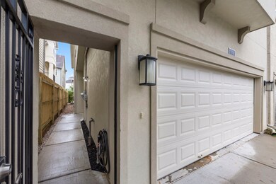 The front door is tucked away behind the gate.