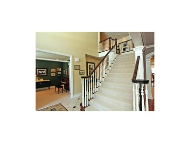 Elegant entry with grand staircase opens to the HU