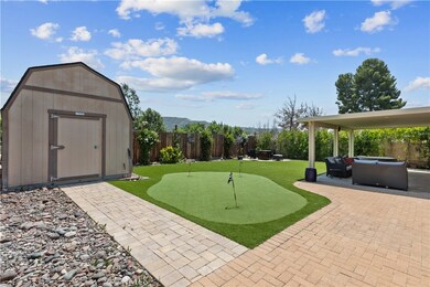 Backyard with Turf, Putting Green & Oversized Walk-in Shed
