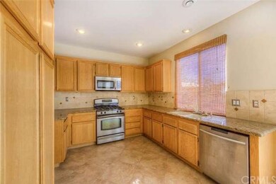 Lots of rich wood cabinets for plenty of storage.