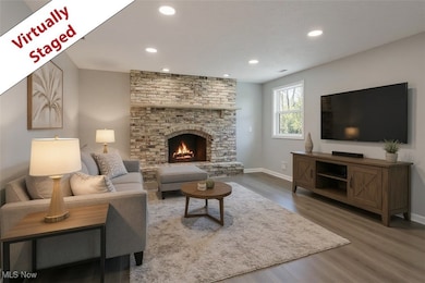 3740 Wilson Sharpsville Rd, Cortland, Ohio 44410 – Your dream home awaits! This stunning 5-bed, 3-bath single-family residence, completely renovated top-to-bottom, sits on a spacious 0.58-acre lot, blending luxury, functionality, and room to grow. Step into a bright, airy open-concept living space, perfect for modern living and effortless entertaining. The heart of the home is a gourmet kitchen featuring sleek Black Stainless Steel Samsung appliances, gorgeous Quartz Countertops, and an oversized island—ideal for meal prep, casual dining, or hosting. Enjoy abundant natural light through new windows and great installed lighting. Luxury LVT Shaw flooring flows seamlessly throughout, adding warmth and durability. Each of the three full bathrooms is beautifully updated with stylish finishes, offering a spa-like retreat.