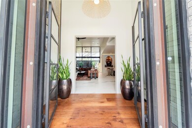 Foyer entrance with light hardwood / wood-style fl