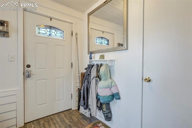 Entryway with wood finished floors