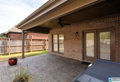 Covered patio in back is perfect for private parti