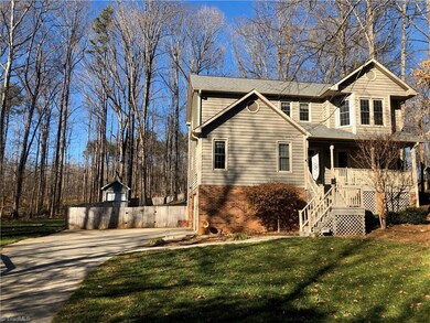 Exterior front.  Fenced yard and shed in rear.