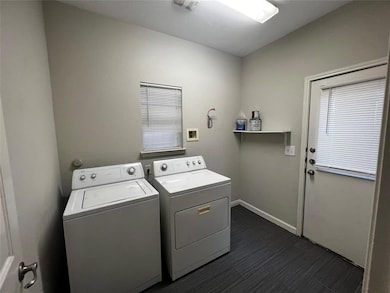 Laundry room with washing machine and clothes dry