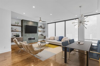 Second floor open living space. Floor to ceiling w