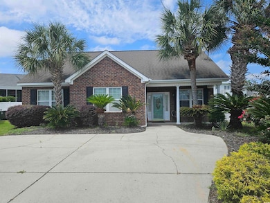 Ranch-style home with brick siding and a shingled roof