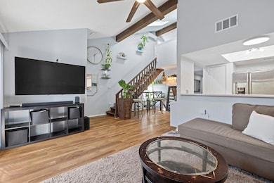 Living area with beam ceiling, high vaulted ceili