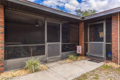 View of exterior entry with brick siding