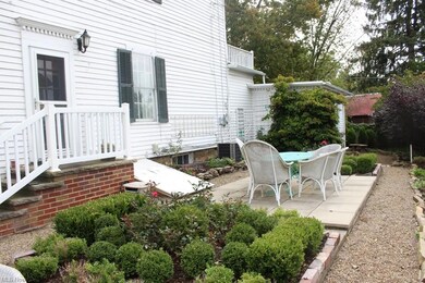 beautiful perennial garden, patio, and side entran