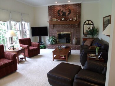 GREAT FAMILY ROOM WITH A WALL OF WINDOS