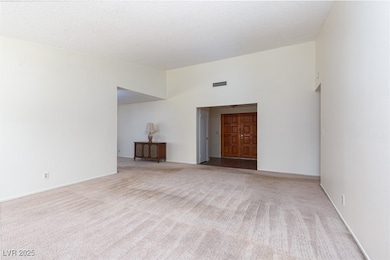 Foyer and Living room with vaulted ceiling
