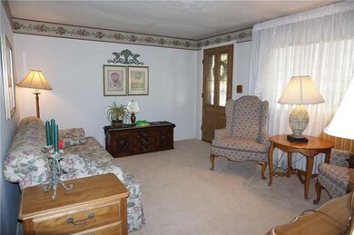 Inviting Living Room with w/w carpeting and large 