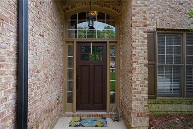 Entrance to property with brick siding