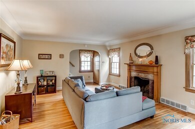 Living Room - Coved Ceilings and Hardwood Floors