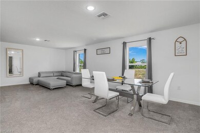 Carpeted dining space featuring baseboards, visibl