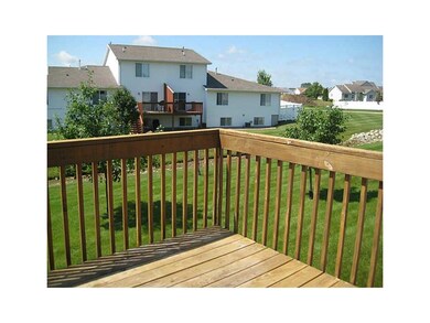 Deck. Nice space between buildings. Trees getting 