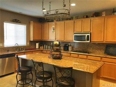Spacious Kitchen with Granite and Stainless Applia