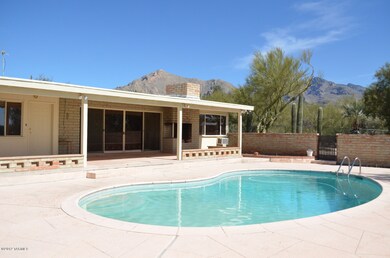 VIEW OF COVERED PATIO AND POOL