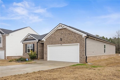View of front facade featuring concrete driveway, 