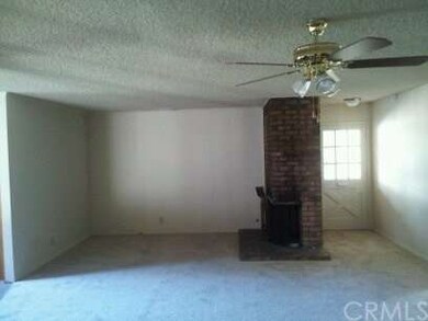 View of living room from back wall towards front d