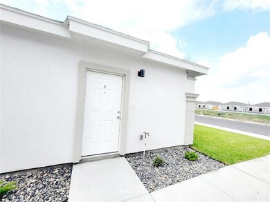 Entrance to property featuring stucco siding
