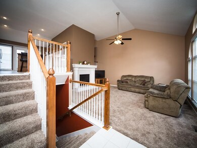 Living Room- Carpet, Ceiling Fan, Vaulted Ceiling,