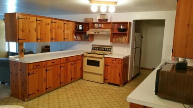 First view of the 19' x 12' eat-in kitchen with cu