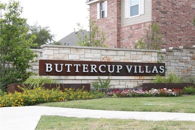 Community sign featuring a lawn
