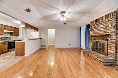 Cozy living room, centered around a fireplace.