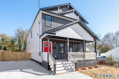 View of front facade featuring a porch and board and batten siding