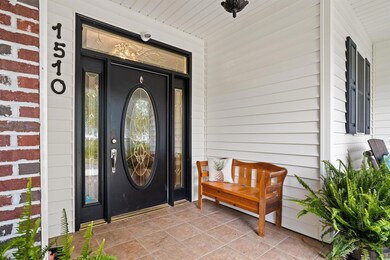 Property entrance with covered porch