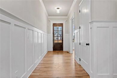 Doorway to outside with a decorative wall, crown m
