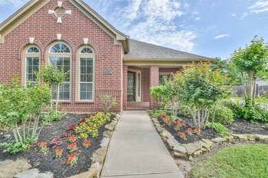 Walking up to the front of this home, you will be greeted  by Colorful Foliage.