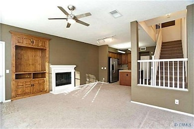 Living Room w/ Built-In Cabinets & Fireplace